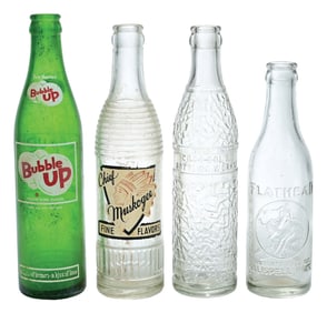 COLLECTION OF 4 VARIOUS GLASS SODA BOTTLES