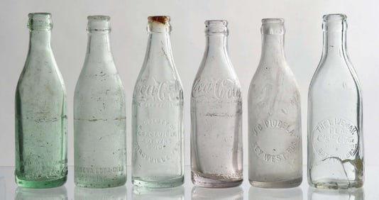 COLLECTION OF 6 STRAIGHT-SIDED GLASS BOTTLES