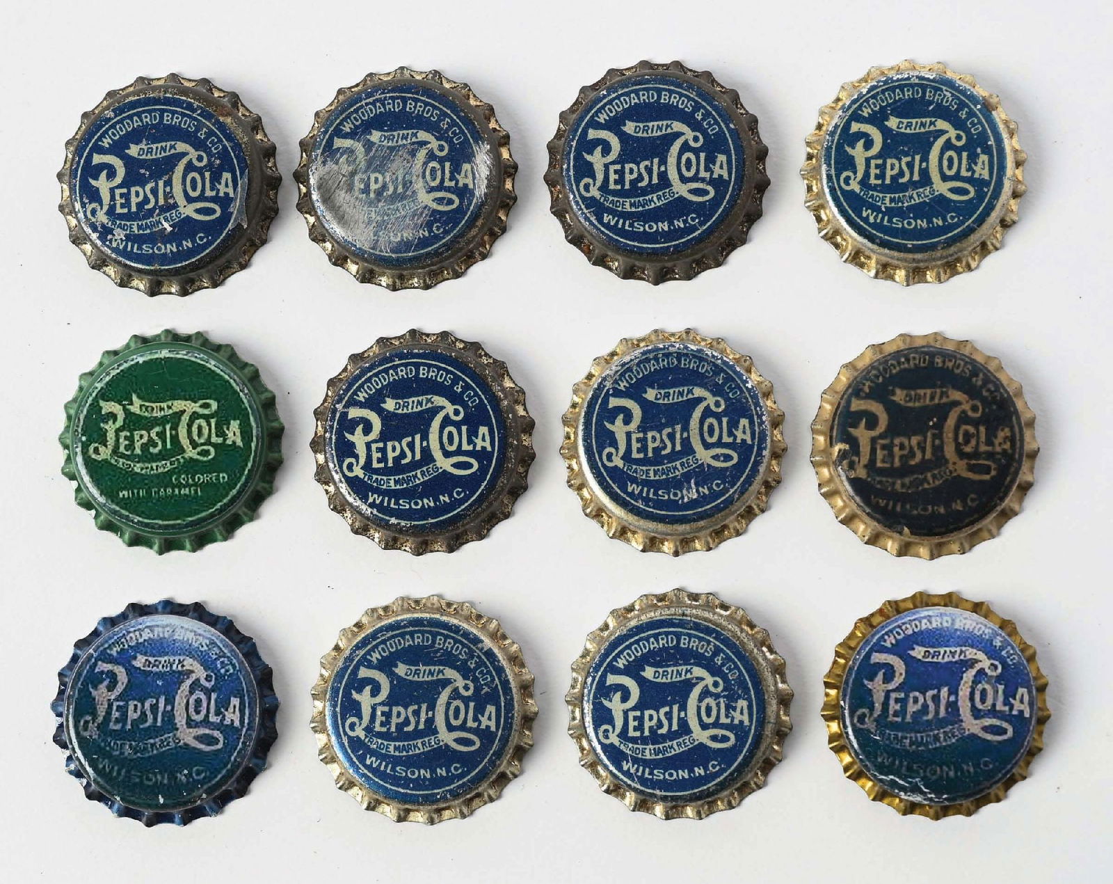 COLLECTION OF 12 BLUE AND GREEN PEPSI-COLA REPRODUCTION BOTTLE CAPS (1 of 2)