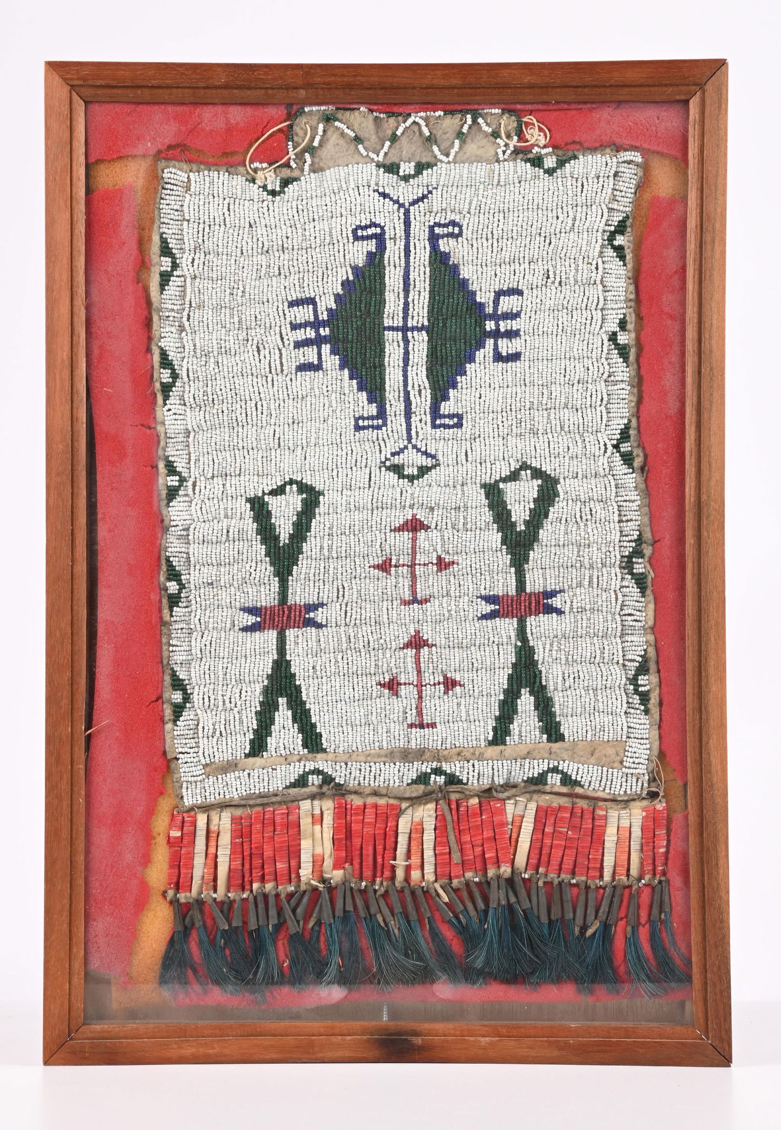 SIOUX INDIAN BEADED BREAST ORNAMENT: Beaded and quilled Lakota panel. Back of frame has small label that reads: BREAST ORNAMENT / SIOUX - PINE RIDGE AGENCY / 1880-1890 / SINEW SEWN. CONDITION: Very good. Not examined outside of frame. Di
