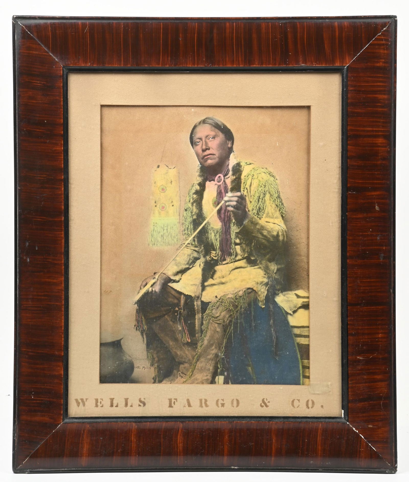 CARL MOON (1878-1948): Arrow Maker Hand Colored Print for Wells Fargo & Co. 15 1/2 x 11 3/4 in. Signed in lower-left "Carl Moon" Framed to 25 1/2 x 21 1/2 in. Dimensions: Framed: 25 1/2" x 21 1/2"