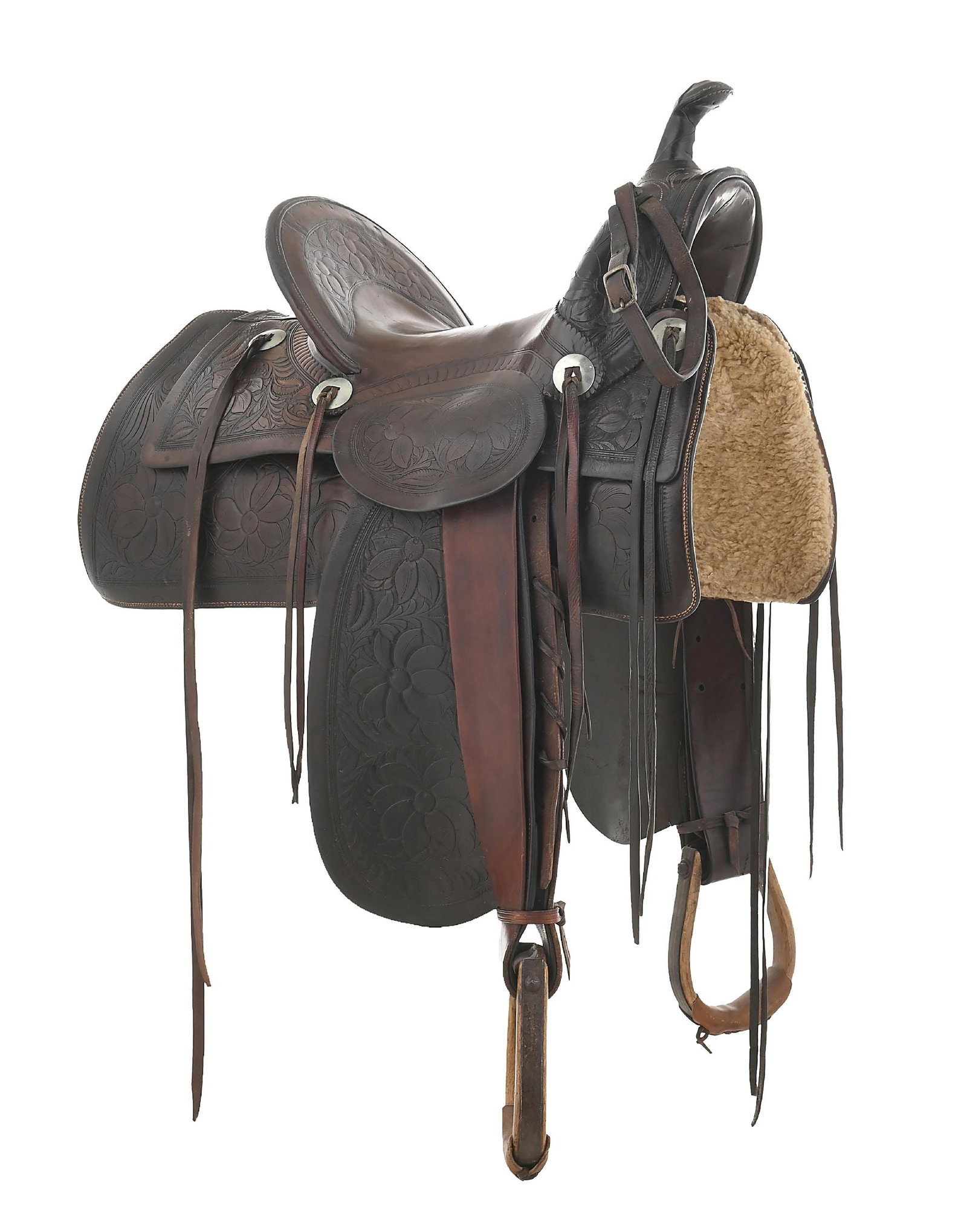 F. A. MEANEA CHEYENNE WYOMING SADDLE: A large square skirt saddle with floral tooling and a clear cartouche on the seat within a five-point star. There is a person's name scratched into the seat, no affecting the look of the leather. Four