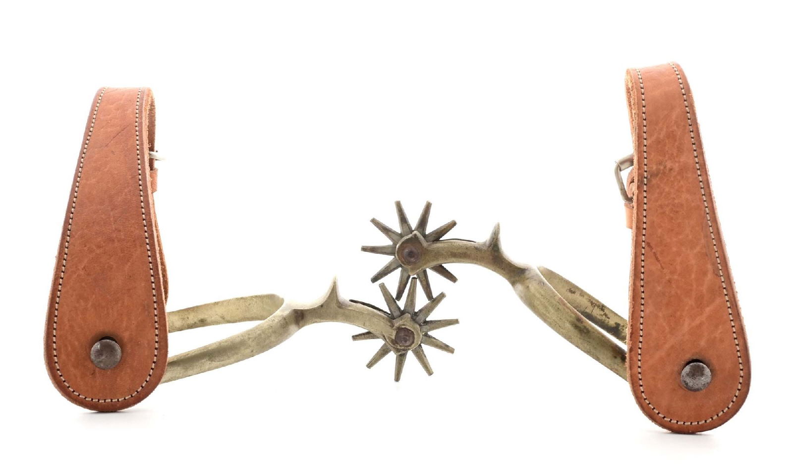 AUGUST BUERMANN SPURS.: Matched pair of pre-1926 Buermann "Steel Silver" western spurs. 1/2" band, 2" shank and 1 3/4" rowel. CONDITION: Very good with rowels that spin freely.