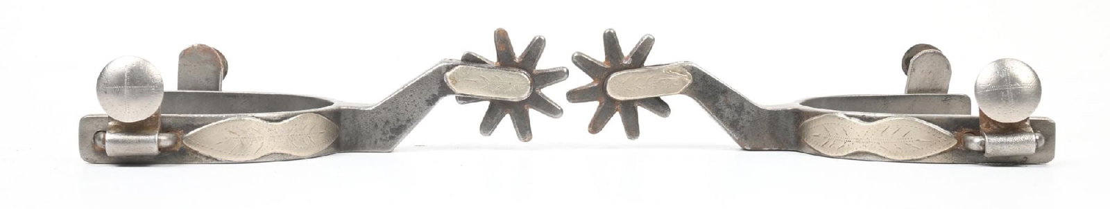 CROCKETT SPURS "THE SAN MIGUEL" STYLE 1: Silver overlaid panels with leaf designs. 5/8" band x 2 1/2" shanks x 1 1/2" rowels. CONDITION: Very good. Dimensions: 6 1/4" x 4" x 1 1/2".