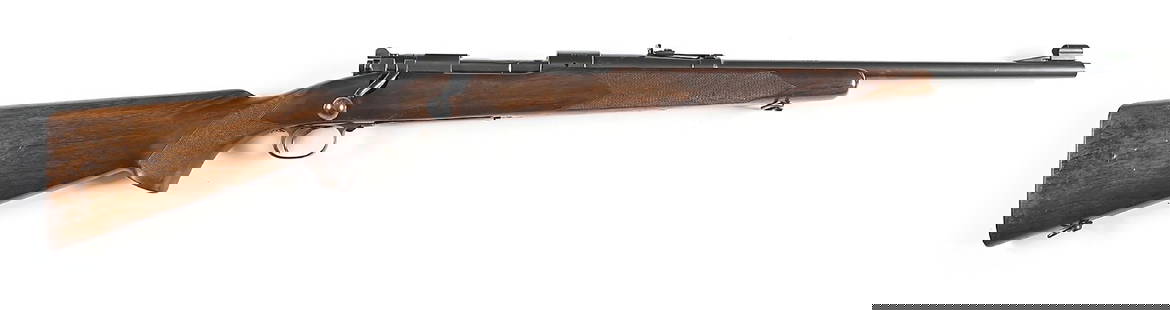 (C) VERY RARE PRE-WAR WINCHESTER MODEL 70 9X57 BOLT ACTION CARBINE.: Receiver dates to 1938. Underside of barrel is dated 1938 with "VP" and "9MM". According to records, Winchester offered the 9x57mm as a special order from 1937 as a limited production. The Winchester