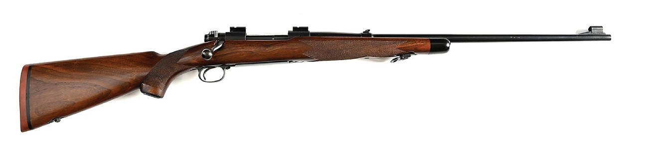 (C) RARE PRE-64 SUPERGRADE WINCHESTER MODEL 70 BOLT ACTION RIFLE IN .338 WIN MAG.: Receiver dates to 1960. It is believed that only 211 Model 70s in .338 Winchester Magnum were built between 1955-60, with an unknown number of Super Grades. The walnut Super Grade stock features the c