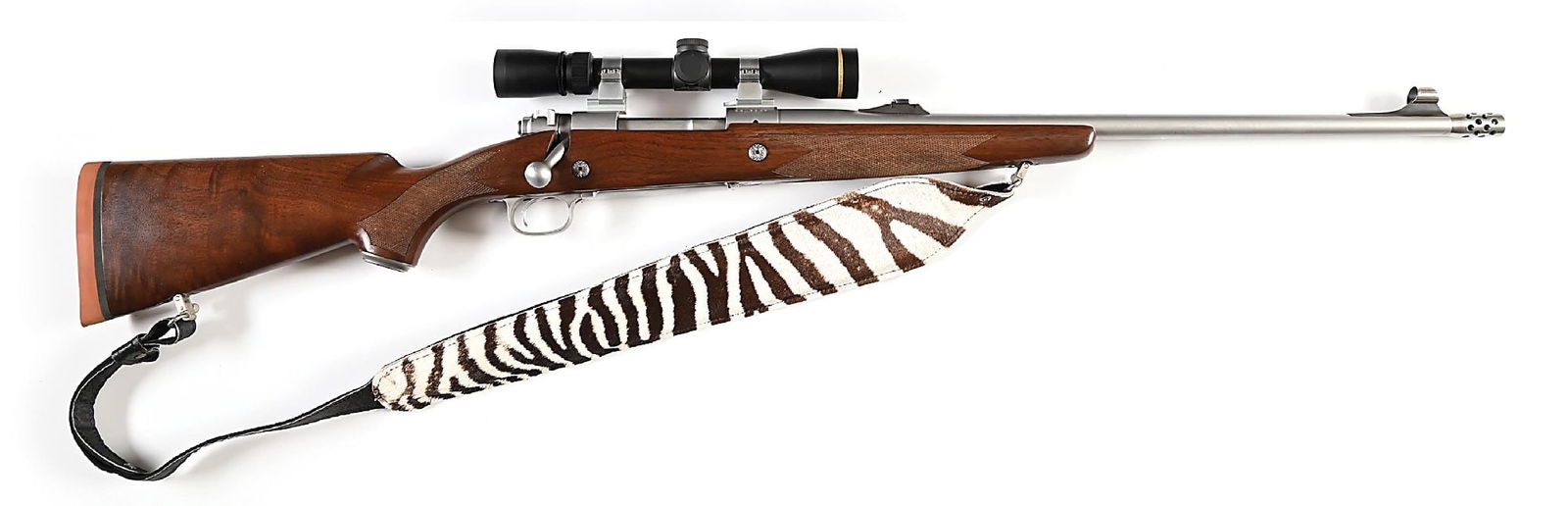 (M) STAINLESS WINCHESTER MODEL 70 .416 REM MAG SAFARI EXPRESS BOLT ACTION RIFLE WITH LEUPOLD OPTIC.: This rifle features all brushed stainless finish, hooded ramp front sight, folding leaf rear sight on base, ported muzzle break, walnut stock with checkered pistol grip, straight comb, solid rubber Wi