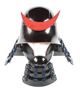 ZUNARI KABUTO WITH MAEDATE AND HANBO: Bowl constructed of five plates, with brown lacquer, and a five lame shikoro, four lames bound with blue cord and one bolted directly to the bowl. Mizabashi with two prongs bolted to the face for maed