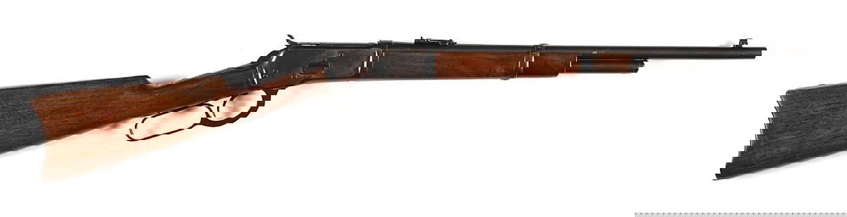 (C) UNUSUAL WINCHESTER MODEL 1892 SADDLE RING SHORT CARBINE (1919).: Dates to 1919. This carbine sports an 18" barrel with a blued crown. Center to front sight set back is 1 - 1/4". The 2/3rds length tube has rounded cap. Finish is standard blue with a pinned bead on b