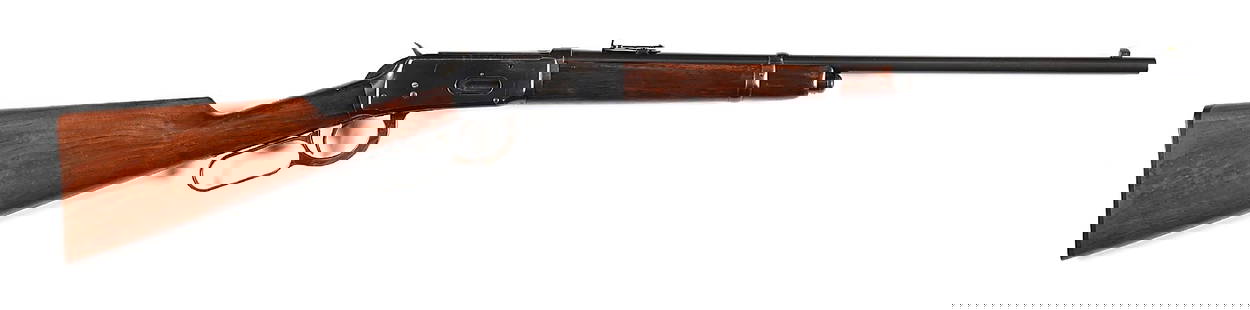 (C) SPECIAL ORDER WINCHESTER MODEL 1894 SADDLE RING CARBINE IN .38-55.: Frame dated to 1903 and has no PW proofs. The barrel exhibits the early two line type 2 legend and the corresponding early type 1A tang legend. Special features include the half magazine and black Win