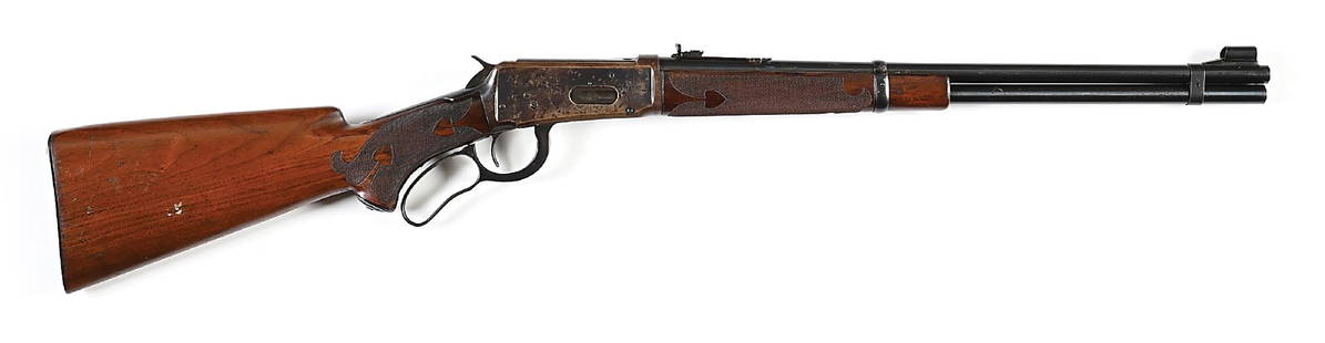 (C) DELUXE WINCHESTER MODEL 1894 SADDLE RING CARBINE IN .25-35.: Dates to 1902. This is a custom built carbine. The barrel legend is a late type 8. The front barrel band is a flat style using during WWII era. The carbine letters with set trigger in .30, with checke