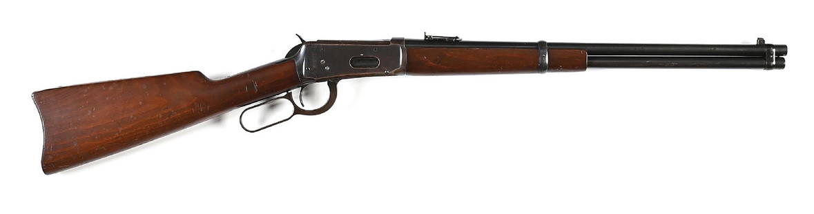 (C) PRE-WAR WINCHESTER MODEL 1894 SADDLE RING CARBINE IN .38-55 (1920)..: This classic dates to 1920. It is standard in all respects with blue finish, full length magazine tube, pinned blade on base front sight, Winchester folding ladder carbine sight, saddle ring and stud,