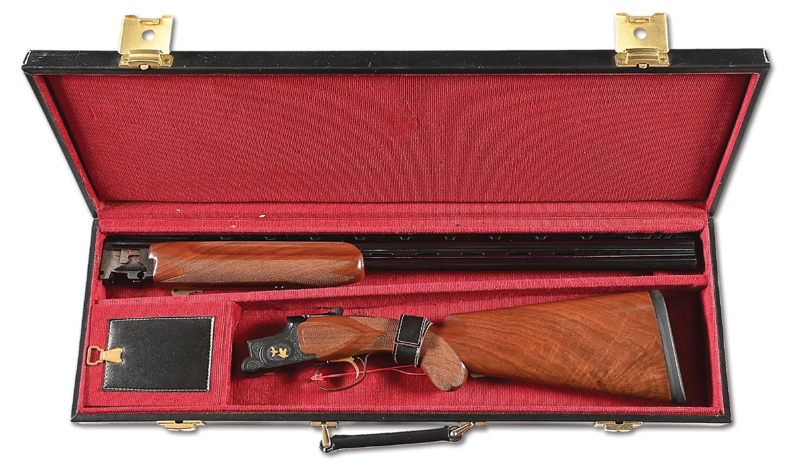 (M) GOLD INLAID ENGRAVED PIGEON GRADE LIGHT WEIGHT WINCHESTER MODEL 101 20 BORE OVER UNDER SHOTGUN.: This shotgun features a blued frame with both sides displaying vignettes of two gold overlay grouse. The base also features a gold overlay bird in brush figure. All are surrounded by tight scroll and 