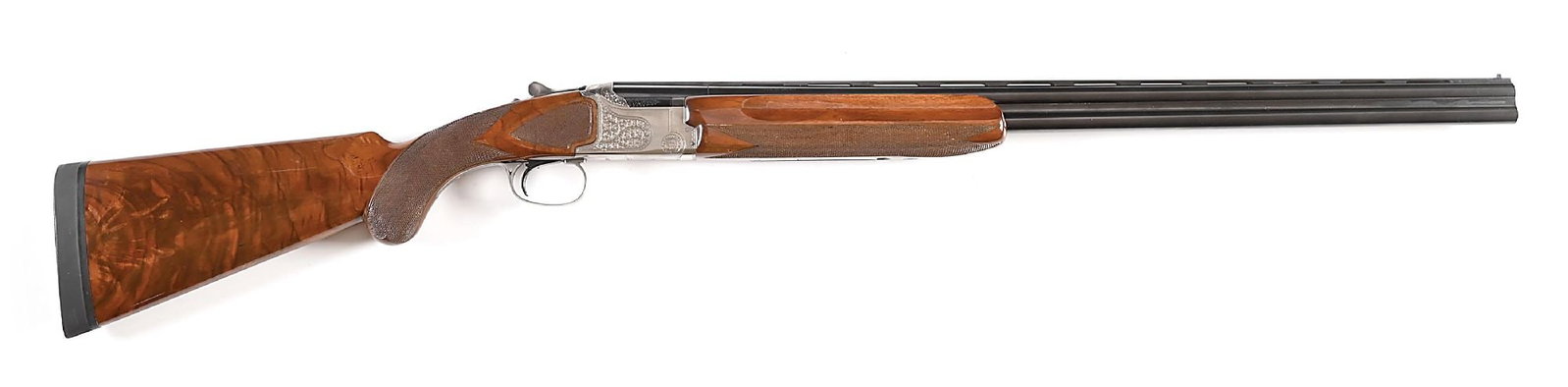 (M) ENGRAVED PIGEON GRADE WINCHESTER MODEL 101 OVER UNDER 20 GAUGE SHOTGUN.: Manufactured in Japan for Winchester. Blued steel barrel with "PIGEON GRADE" marked ventilated rib, double white bead sights, and ejectors. Coin finished receiver engraved with tight foliate scroll, a