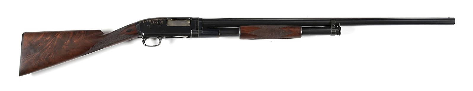 (C) TRAP GRADE WINCHESTER MODEL 1912 BLACK DIAMOND SLIDE ACTION SHOTGUN.: Manufactured in 1916. Black Diamond Trap was never a Winchester catalog title, is is simply the Trap marked version with ebony black diamonds on both sides of wrist. The example features at least XXX