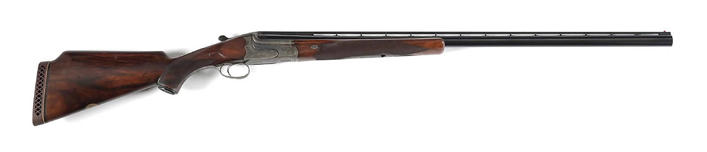 (C) PRE-WAR PRUSSIAN CHARLES DALY 12 GAUGE SINGLE BARREL TRAP SHOTGUN.: Barrel is dated 11-31. The Prussian Krupp steel Daly shotguns were of superior quality. This example features the engraved case color frame with light scrolls on both sides with a pair of hunting dogs