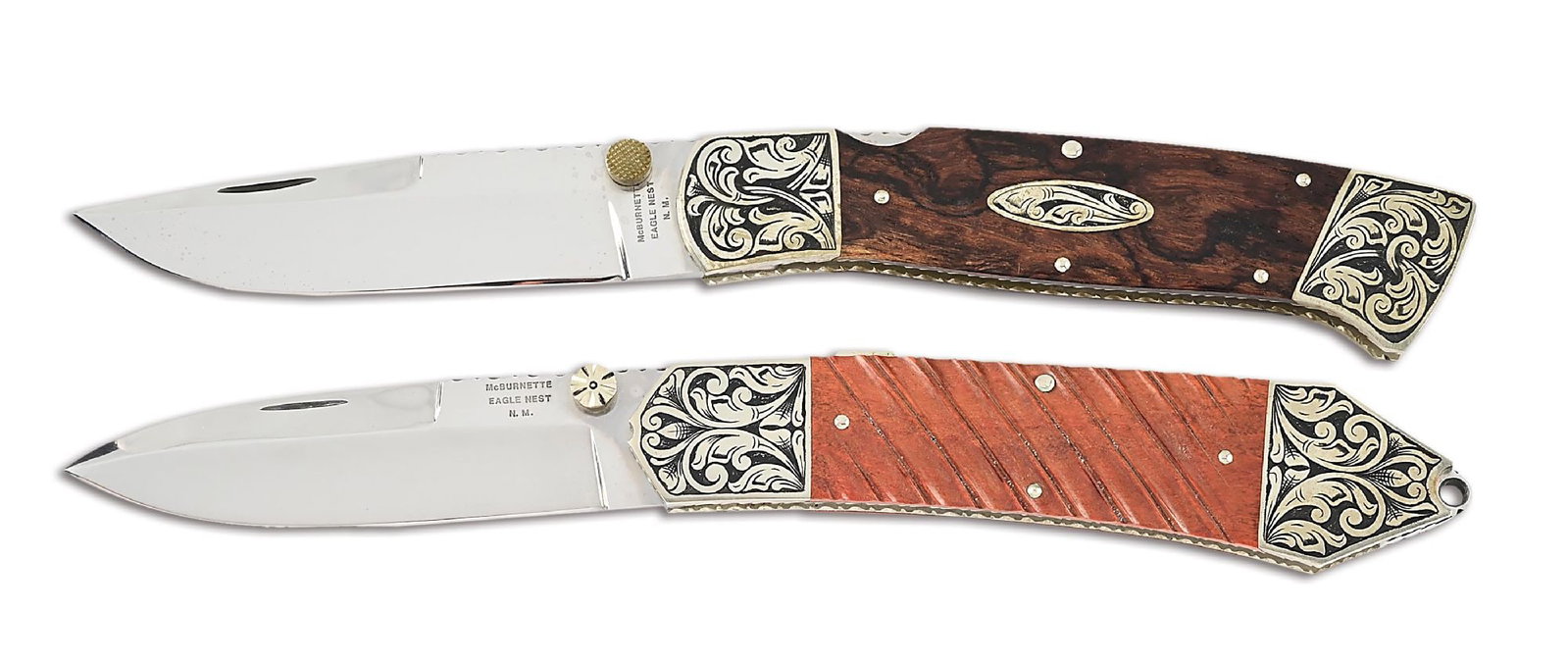 LOT OF 2: HARVEY MCBURNETTE LARGE FRONT LOCK KNIVES.: Lot consists of: (A) Mirror polished drop point blade with nail nick assist and a checkered nickel silver thumbstud. Blade is marked "McBURNETTE / EAGLE NEST / N.M." on obverse ricasso. Spine is filew