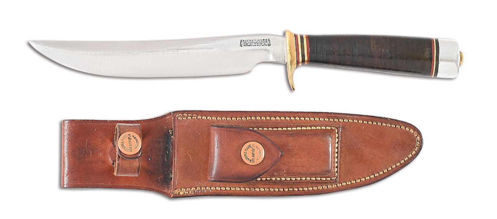 EARLY WWII ERA RANDALL MODEL 3 HUNTER IN A HEISER MODEL 1-7 FIGHTER SCABBARD.: In November 1943, Bo Randall decided to redesign one of his Scagel-style hunters so it could use the same hilt, handle, and pommel as his popular Model 1 Fighter. Due to the new configuration they wer