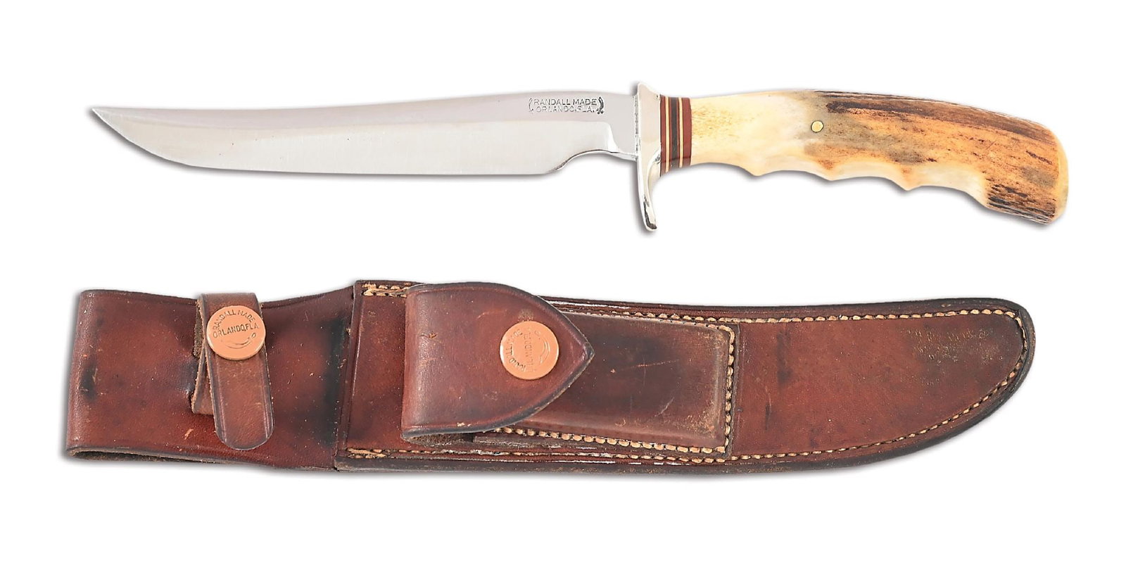 EARLY RANDALL MODEL 3 HUNTER WITH HEISER SCABBARD.: Circa 1940s-1950s Randall Model 3 Hunter with a carbon steel blade that exhibits an older polishing. The distinct "RANDALL MADE / ORLANDO, FLA." mark between Randall's signature scimitars is located o