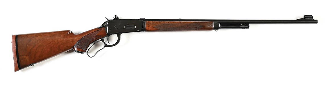 (C) DELUXE WINCHESTER MODEL 64 LEVER ACTION RIFLE (1953).: Manufactured in 1953. The deluxe features walnut stocks with checkered pistol grip, Winchester cap, newer Winchester solid red pad, deluxe rear sling swivel, and matching forearm. Finish is standard b