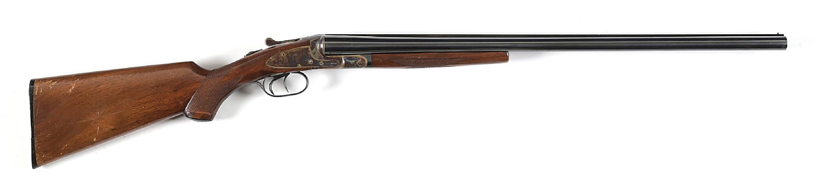 (C) HIGH CONDITION L.C. SMITH SIDE BY SIDE FIELD GRADE 12 GAUGE SHOTGUN.: Circa 1918. Polish blued Armor Steel barrels with raised matted rib and single bead sight. "L.C. SMITH Field GRADE" is stamped between arrow motifs above the right breech. Case hardened featherweight 