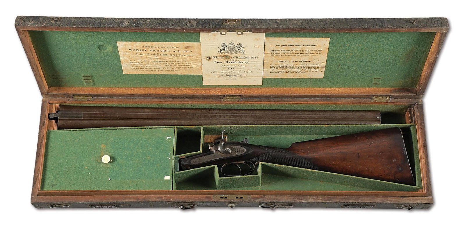 (C) ENGRAVED WESTLY RICHARDS SIDE BY SIDE 12 GAUGE SHOTGUN.: Westley Richards bar-in-wood 12 bore hammer gun with Damascus barrels. Length of pull of 14” to a widow’s peak steel butt plate. English stock, double triggers on a bar-in-wood action, spr