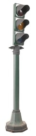 TRAFFIC LIGHT DISPLAY MOUNTED ON CAST IRON POLE.