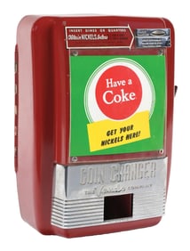 VENDO COIN CHANGER W/ COCA COLA ADVERTISING GRAPHIC.