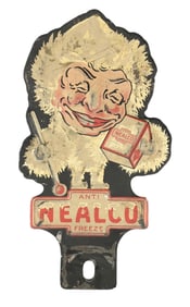 NEALCO ANTI FREEZE EMBOSSED TIN LICENSE PLATE TOPPER W/ ESKIMO GRAPHIC.