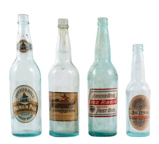 COLLECTION OF 4 CLEAR BREWERIANA BOTTLES