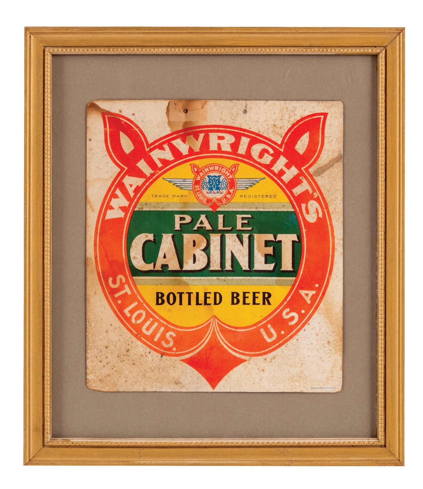 WAINWRIGHTS PALE CABINET BOTTLED BEER SIGN: Pre-Prohibition, St. Louis. Cardboard string hanger sign. CONDITION: Showing some edge wear, foxing and staining throughout, with tears at the string hanger holes. String hanger is missing. Condition:
