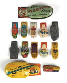 LARGE COLLECTION OF BUSTER BROWN SHOE TIN LITHO TOY CLICKERS