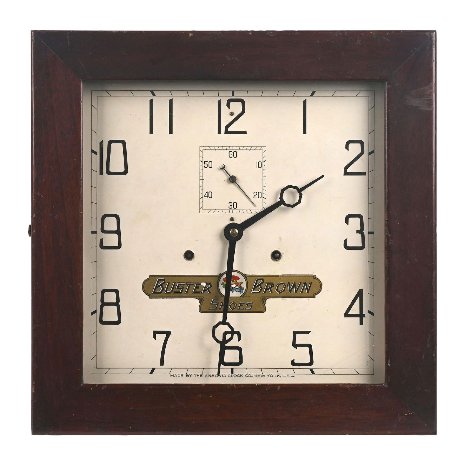 BUSTER BROWN SHOES ADVERTISING CLOCK: A great-looking example of this c. 1920s-1930s wooden wall clock from Buster Brown Shoes, featuring the company logo and young boy mascot. CONDITION: The face of the clock remains nice, with only one