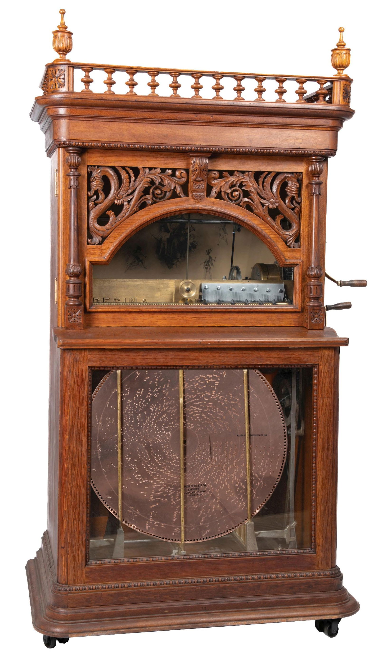 REGINA CORONA STYLE 34 ORCHESTRAL "DRAGON FRONT" AUTO DISC MUSIC BOX: C. 1899, The Regina Music box Co. New Jersey. Perhaps the most well know Regina musical instrument today is the 27" orchestral corona disc changer music box. These instruments were made in a wide vari