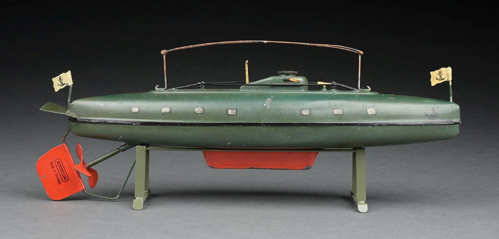 MARKLIN CAT. REF. 5110 HAND-PAINTED SUBMARINE: C. 1930s. CONDITION: Retains original flags. Replacement stand. Excellent to near mint condition. Dimensions: 13 - 1/2" x 3" x 5".