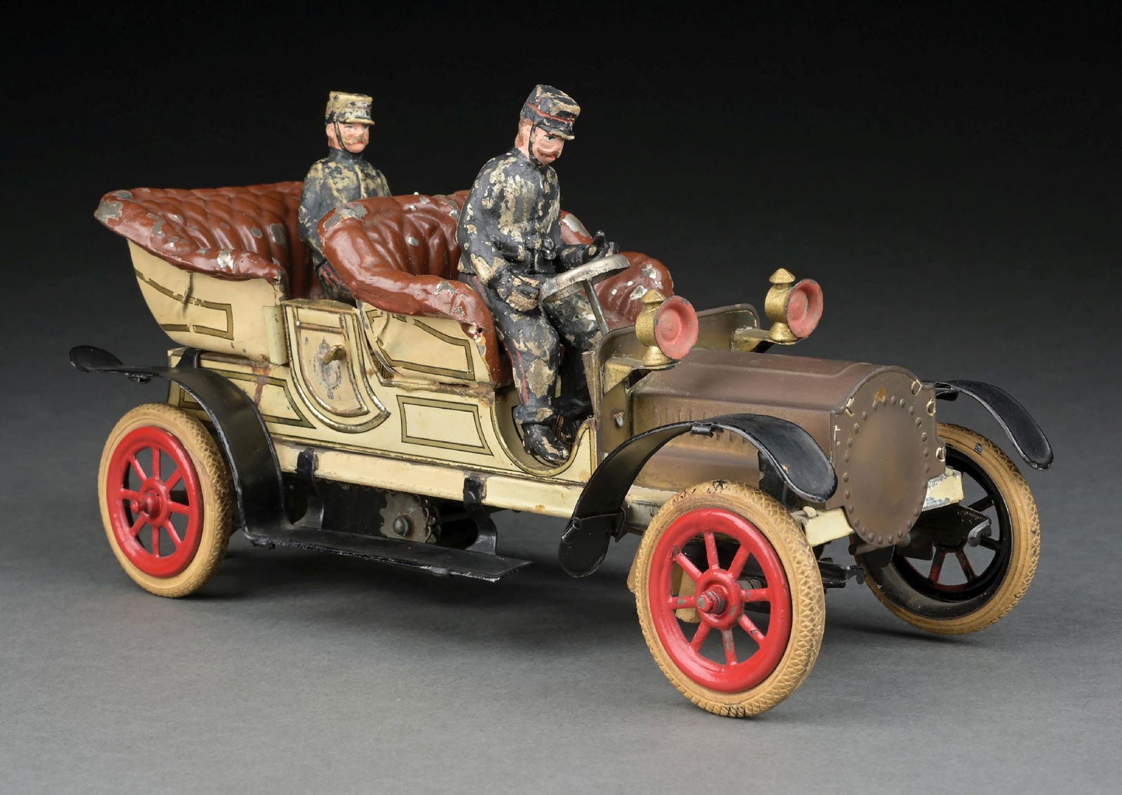 SCARCE VERSION GERMAN TIN LITHO & HAND-PAINTED CLOCKWORK AUTOMOBILE: Unusual chain mechanism on bottom. Also has unusual wheel behind mechanism and bellows on bottom. Not marked, but appears to be Gunthermann. Includes two composition figures, a driver and back figure