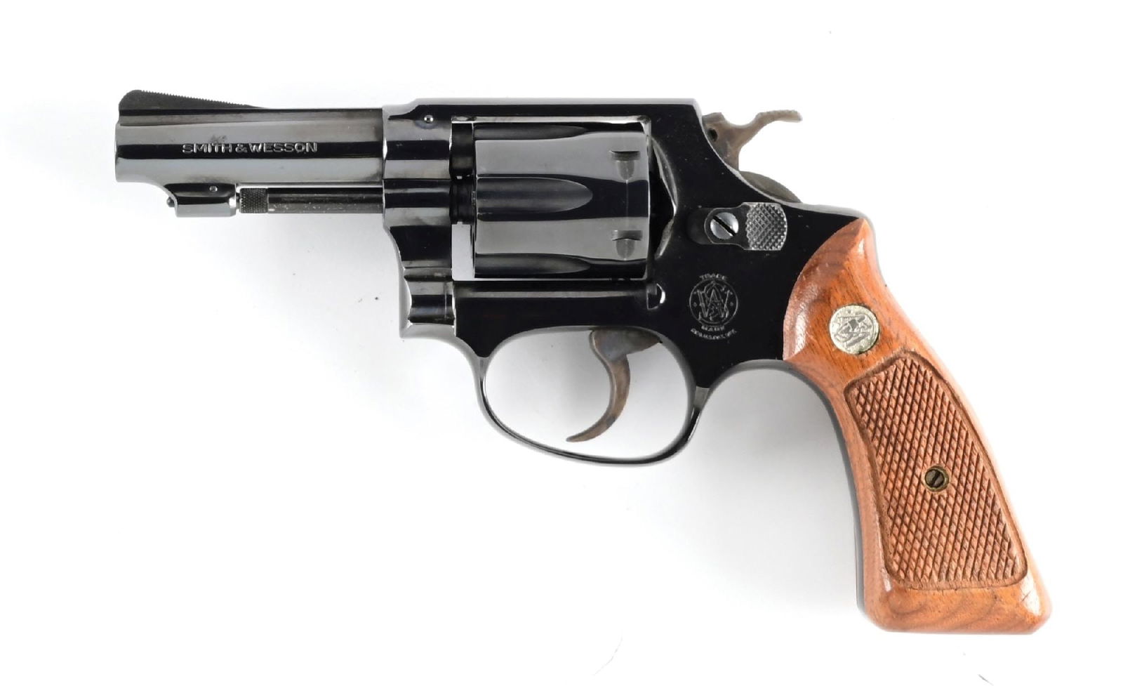 (C) SMITH & WESSON MODEL 31-1 DOUBLE ACTION REVOLVER.: Blued finish with ramped serrated front sight, frame notch rear, and 2-piece checkered walnut grips with silver S&W medallions. CONDITION: Very Good, shiny bore with strong rifling. Barrel Length: 3"