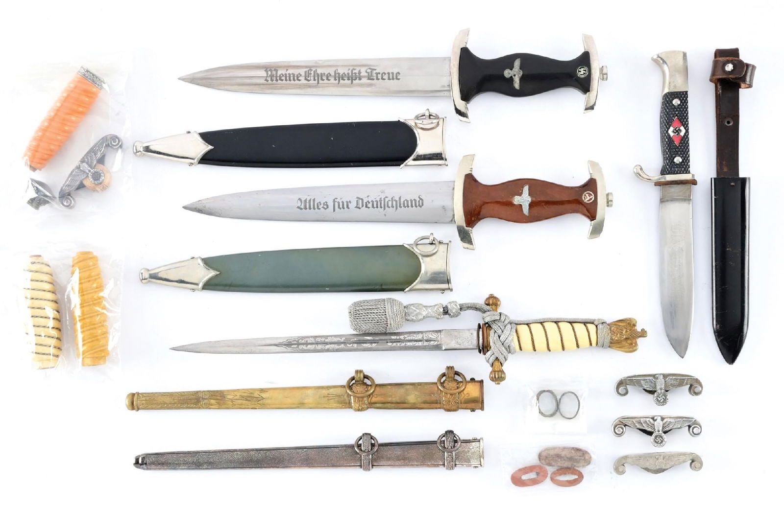 LOT OF THIRD RIECH PARTS DAGGERS AND MISCELLANEOUS DAGGER PARTS.: Lot consists of several Third Reich daggers that are composed of original parts, but were pieced together after the war. (A) SS dagger with an "RZM / 941/39 SS" marked blade with runner marks and scat