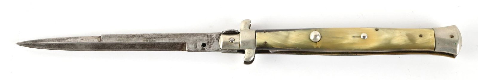 LARGE RING CUTLERY B. SVBODA SWITCHBLADE.: Blade with gray patina and ricasso marked "RING CUTLERY / B. SVBODA / ITALY". Silvered S-guard. Brass liners. Horn grip scales with one crack at button on obverse and chip in reverse. Locking mechanis