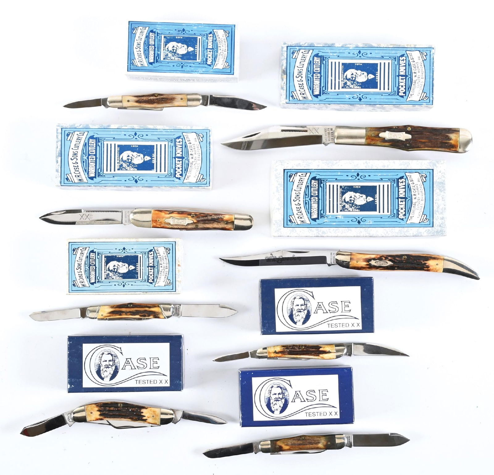 LOT OF 8: BOXED CASE FOLDING KNIVES.: Lot consists of eight 1990s Case folding knives contained in their original boxes. The models vary but all knives have stag grip scales. All knives exhibit handling wear with scattered blemishes. Boxe