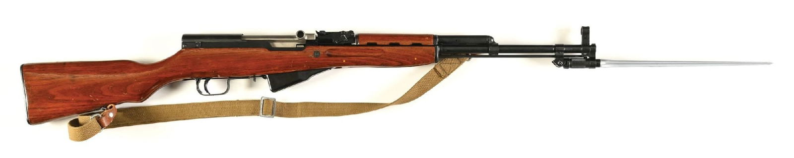 (M) NORINCO SKS SEMI AUTOMATIC RIFLE.: Standard configuration with blued finish, hooded post front sight, tangent rear, folding spike bayonet, and 2-piece wood stocks. Import marked on the receiver. CONDITION: Very Good, shiny bore. Barrel