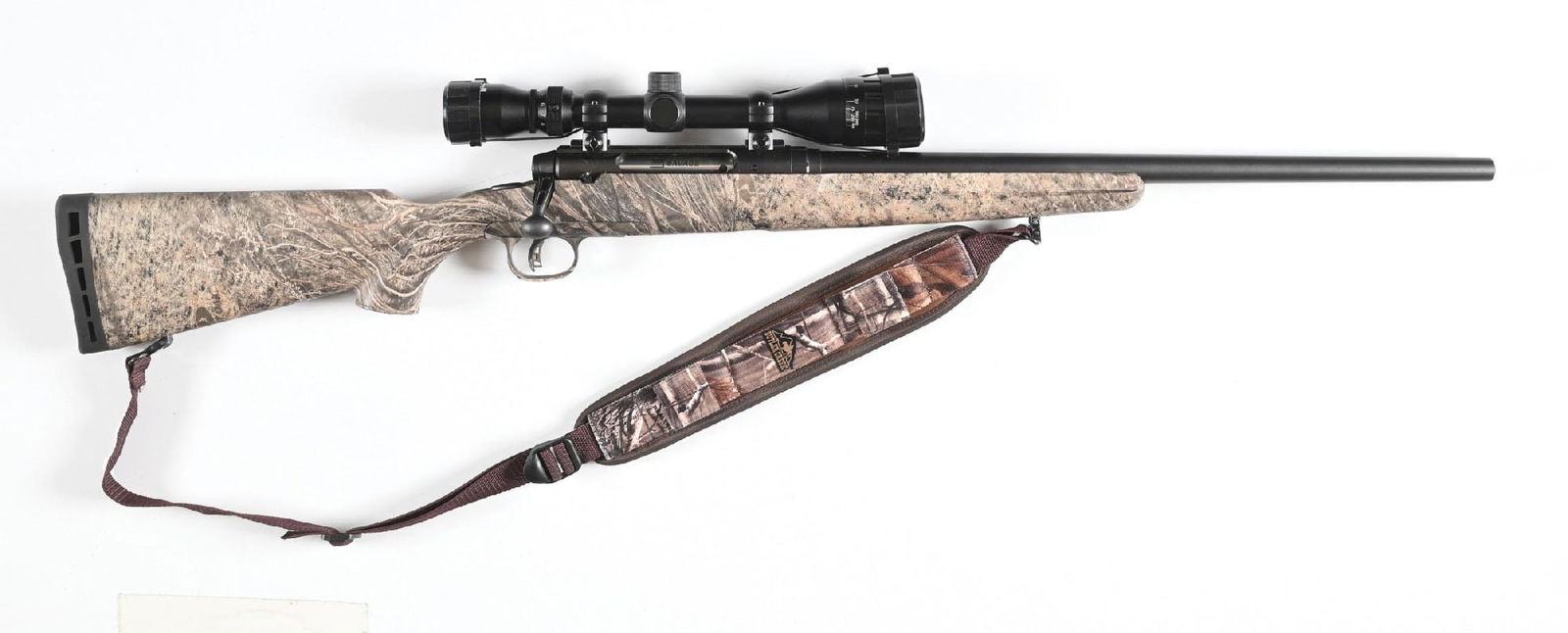 (M) SAVAGE AXIS BOLT ACTION RIFLE IN 6.5 CREEDMOOR.: Heavy profile target crowned matte gray barrel without iron sight provisions. Camo dipped synthetic stock with recoil pad. Rifle is mounted with a Bushnell 4-12x scope. Includes sling. CONDITION: Exce