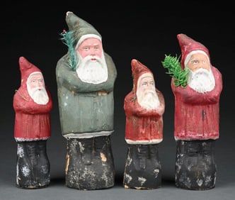 COLLECTION OF 4: PRESSED CARDBOARD SANTAS