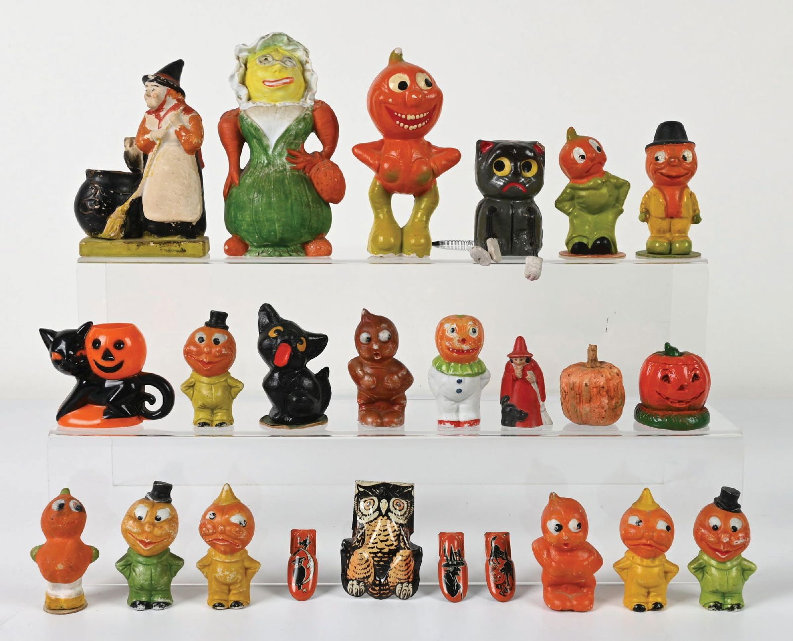 LARGE COLLECTION OF HALLOWEEN FIGURATIVE DECORATIONS: Unique Halloween lot with tons of variety to choose from. Lot contains bisque figures, composition figures, one plastic piece, tin clickers and other miscellaneous pieces as well. Lot features a great