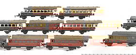 LOT OF 8: VARIOUS GERMAN MARKLIN RHEINGOLD & MITROPA PASSENGER TRAIN CARS: C. 1930s-1940s. Later Marklin mark embossed on bottom of cars. There are four Mitropa cars and four Rheingold cars. Condition: (Very Good). Dimensions: Each: 9 - 1/2" x 2 - 1/4" x 3 - 1/2".