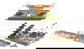 LOT OF 3: TIN TRAIN STATION PAVILIONS AND BRIDGE: (A) Russian Station with paint chips on the roof, benches, and base. Very good. (B) Marklin Crossing with wind-up bell, excellent condition. (C) Bridge for O gauge wind-up, possibly Ives, with some pa