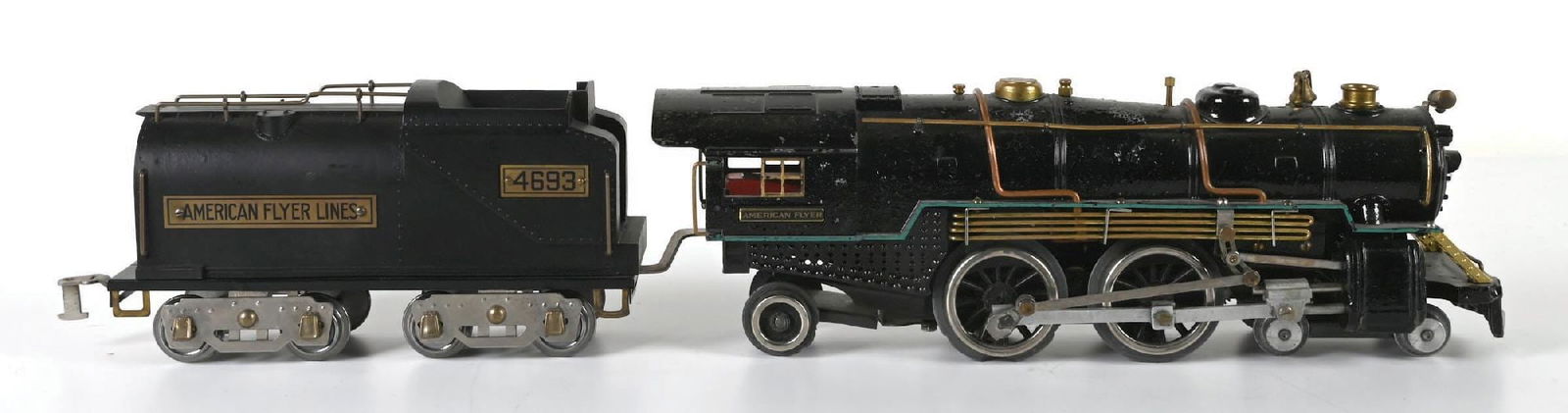 AMERICAN FLYER STANDARD GAUGE 5-PIPER: Some paint loss on the boiler, very good condition. Comes with a No. 4693 restored tender. Condition: Dimensions: Largest: 4" x 17" x 6".