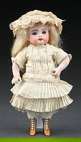 EXCEPTIONALLY PRETTY GERMAN ALL BISQUE DOLL W/ GLASS EYES, OPEN MOUTH, INCISED "102", KNOWN AS THE: This lovely child has blue glass eyes that still sleep, an open mouth with tiny little upper teeth, all Bisque chunky body, yellow boots with black heels that are an integral part of the lower Bisque