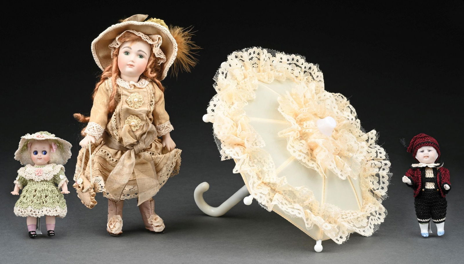 LOT OF 3: ASSORTED VINTAGE ALL BISQUE DOLLS: All three dolls range in sizes. (A) The largest is an elaborate swivel neck, all Bisque immaculately costumed to resemble a French Bisque Bebe or good quality closed-mouth Kesner. She has inset glass