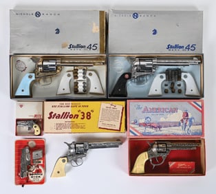 LOT OF 11: VARIOUS VINTAGE ASSORTED CAP GUNS & HOLSETS AMERICAN-MADE VINTAGE CAP GUNS & HOLSTERS